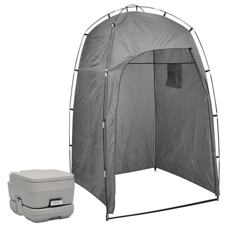 Portable camping toilet with tent and cooler, close-up of bumper and person's foot.